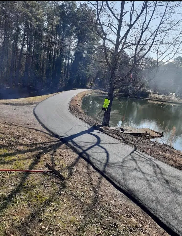 Curved asphalt driveway completed by G&G Asphalt Paving